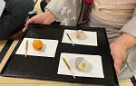 Tray with colorful tea ceremony treats on 3 different white plates